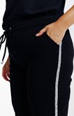 Pantalon style jogging bande paillette