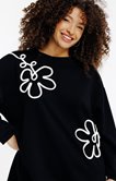 Sweat uni avec fleurs en corde