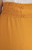 Pantalon fluide avec boutons recouverts
