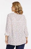Chemise à pois volantée