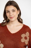 Pull avec fleurs dorées