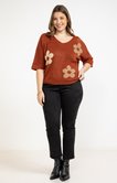 Pull avec fleurs dorées